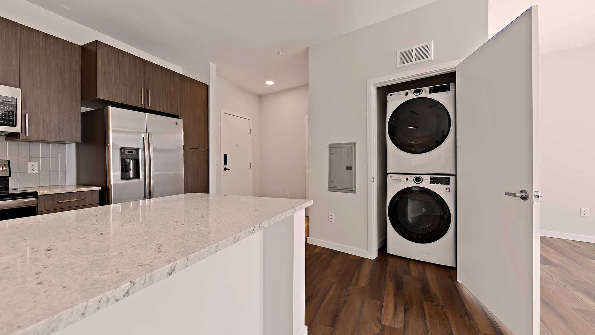 Reve apartments s3 kitchen laundry warm decor view